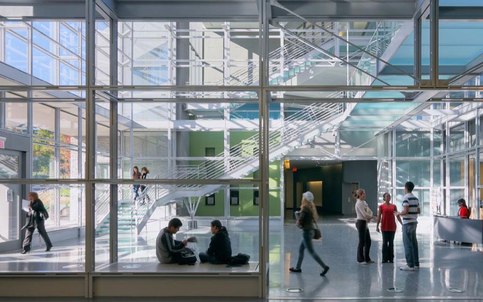 interior of glass building with students