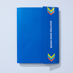 Blue envelope with the words Exciting News Inside